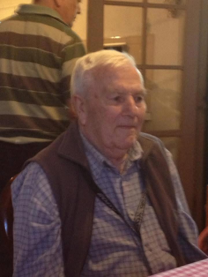 Matthew’s nonno seated at home.